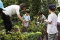 Teacher and kids school learning ecology gardening Royalty Free Stock Photo