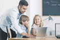 IT teacher with kids Royalty Free Stock Photo