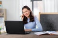 teacher with laptop having online class at home Royalty Free Stock Photo