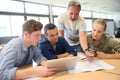 Teacher learning skills to group of students Royalty Free Stock Photo