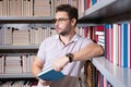 Teacher in library reading book. Teacher school classroom, Teachers day. Knowledge, education. Man teacher with book Royalty Free Stock Photo