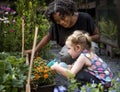 Teacher and little girl school learning ecology gardening Royalty Free Stock Photo