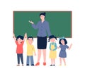 Teacher and little preschool children stand at chalkboard. Happy students, flat back to school concept. Education and Royalty Free Stock Photo