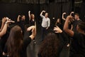 Teacher With Male And Female Drama Students At Performing Arts School In Studio Improvisation Class Royalty Free Stock Photo