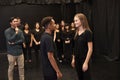 Teacher With Male And Female Drama Students At Performing Arts School In Studio Improvisation Class Royalty Free Stock Photo
