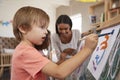 Teacher At Montessori School Helping Children in Art Class Royalty Free Stock Photo