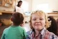 Teacher At Montessori School Reading To Children At Story Time Royalty Free Stock Photo