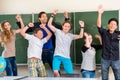 Teacher motivating students in school class Royalty Free Stock Photo