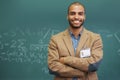 Teacher, portrait and chalk board for math class or education learning or professor, university or confidence. Male Royalty Free Stock Photo