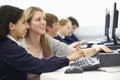 Teacher And Pupil In School Computer Class Royalty Free Stock Photo