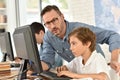 Teacher with pupils in computing class Royalty Free Stock Photo