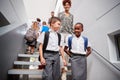 Teacher And Pupils Walking Down Stairs In Busy Elementary School Corridor Royalty Free Stock Photo