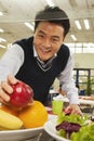 Teacher reaching for healthy food in school cafeteria