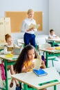 teacher reading book with children