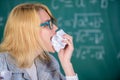 Teacher ready to eat her paperwork. Teacher eats piece of paper absorb information. Woman teacher eats crumpled piece of Royalty Free Stock Photo