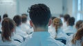 A teacher's back view with rows of students in uniforms facing a blackboard.. AI generated Royalty Free Stock Photo