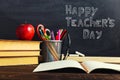 Teacher's desk with writing materials, a book and an apple, a blank for text or a background for a school theme. Copy space Royalty Free Stock Photo