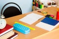 Teacher's desk with writing materials, a book and a blank for text or a background for a school theme. Copy space. Royalty Free Stock Photo