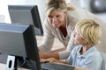 Teacher with schoolboy on computer Royalty Free Stock Photo