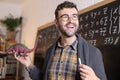 Teacher showing a dinosaur in biology class