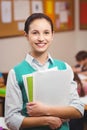 Teacher smiling at camera in classroom Royalty Free Stock Photo