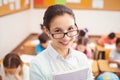 Teacher smiling at camera in classroom Royalty Free Stock Photo