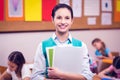 Teacher smiling at camera in classroom Royalty Free Stock Photo