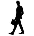 Teacher in sports jacket with a business briefcase, laptop bag in hand. An attractive man in a men`s business slim suit. silhouett