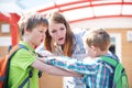 Teacher Stopping Two Boys Fighting In Playground Royalty Free Stock Photo