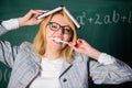 Teacher stress and burnout. Overwork and lack of support driving teacher out of profession. Teacher woman with book Royalty Free Stock Photo