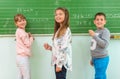 Teacher and student at the blackboard, math class Royalty Free Stock Photo