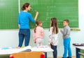 Teacher and student at the blackboard, math class Royalty Free Stock Photo