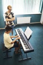 Teacher and student in the classroom of music school Royalty Free Stock Photo