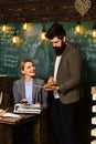 Teacher and student have lesson. Businessman work with woman secretary in school office. Bearded man and sensual woman Royalty Free Stock Photo