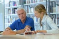 teacher with student in library Royalty Free Stock Photo