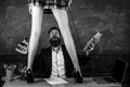 Teacher and student - love story. Sexy education. Bearded sexology teacher looks at two sexy female students. Erotic Royalty Free Stock Photo