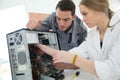 Teacher with student repairing computer Royalty Free Stock Photo