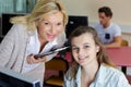 teacher and student sitting at table Royalty Free Stock Photo