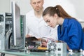 Teacher with student in technology repairing computer Royalty Free Stock Photo