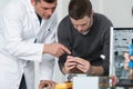 Teacher with student in technology repairing computer Royalty Free Stock Photo