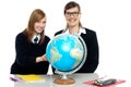 Teacher and student viewing globe Royalty Free Stock Photo