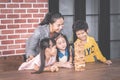 Teacher and students building toy block tower togetherness c Royalty Free Stock Photo