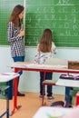 Teacher and students in the classroom: teaching Royalty Free Stock Photo