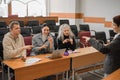 The teacher and students communicate in sign language in the classroom. Hearing impaired and deaf people Royalty Free Stock Photo