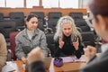 The teacher and students communicate in sign language in the classroom. Hearing impaired and deaf people Royalty Free Stock Photo