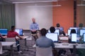 Teacher and students in computer lab classroom