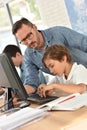 Teacher with students in computing class Royalty Free Stock Photo