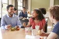 Teacher And Students Eating Lunch In High School Cafeteria During Recess Royalty Free Stock Photo