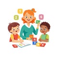 Teacher and students learning math with colorful blocks in a classroom setting Royalty Free Stock Photo