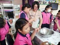 Teacher and students make hand sanitizer.
